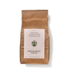 A brown paper coffee bag stands upright.