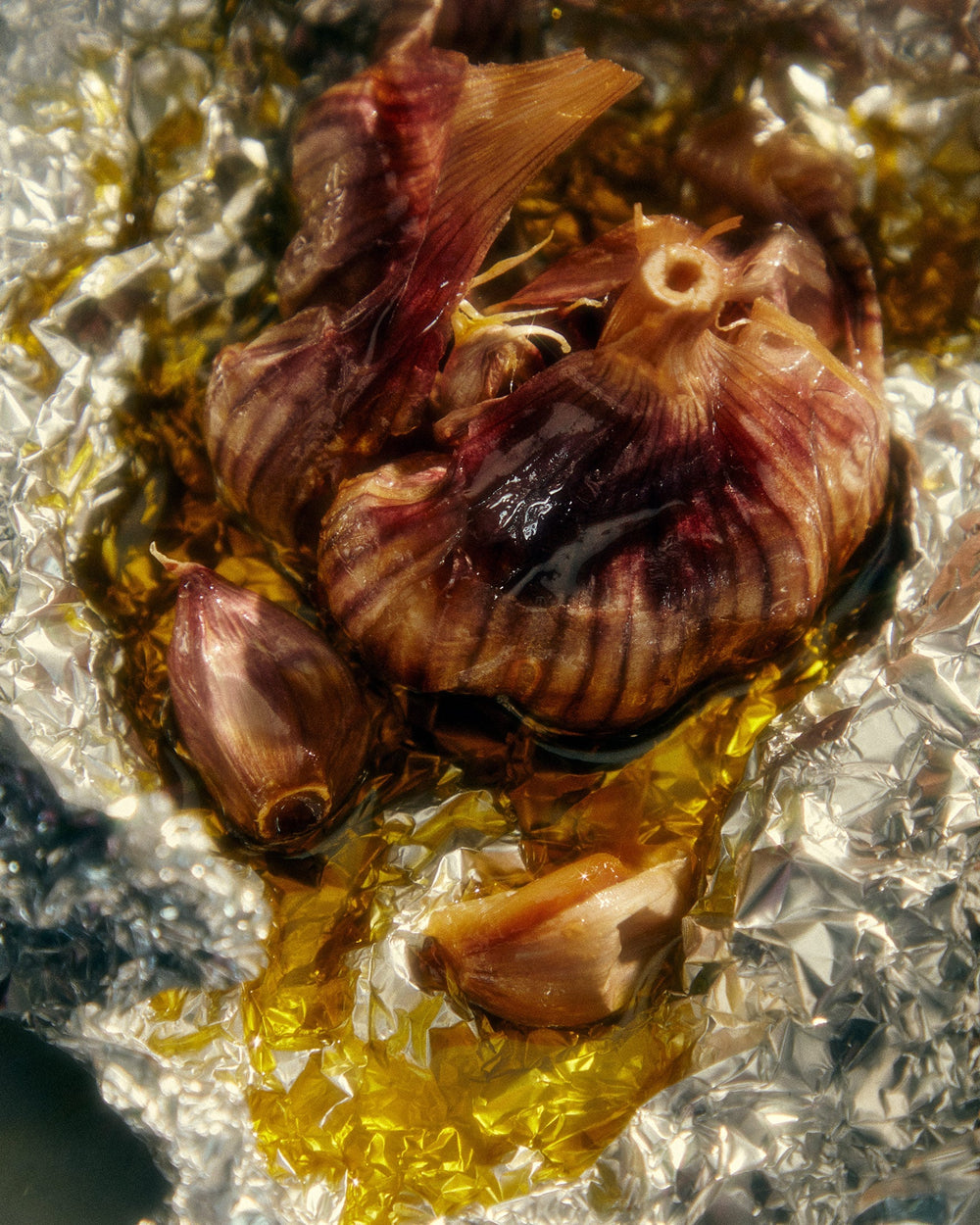 Garlic Infused Olive Oil drizzled over a grilled onion, herbs, and seasoning.