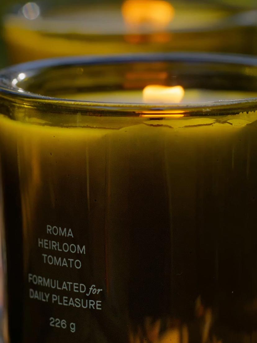 Close Up Of Lit Flamingo Estate Roma Tomato Heirloom Candle