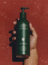 Hand Holding A Bottle Of Flamingo Estate 