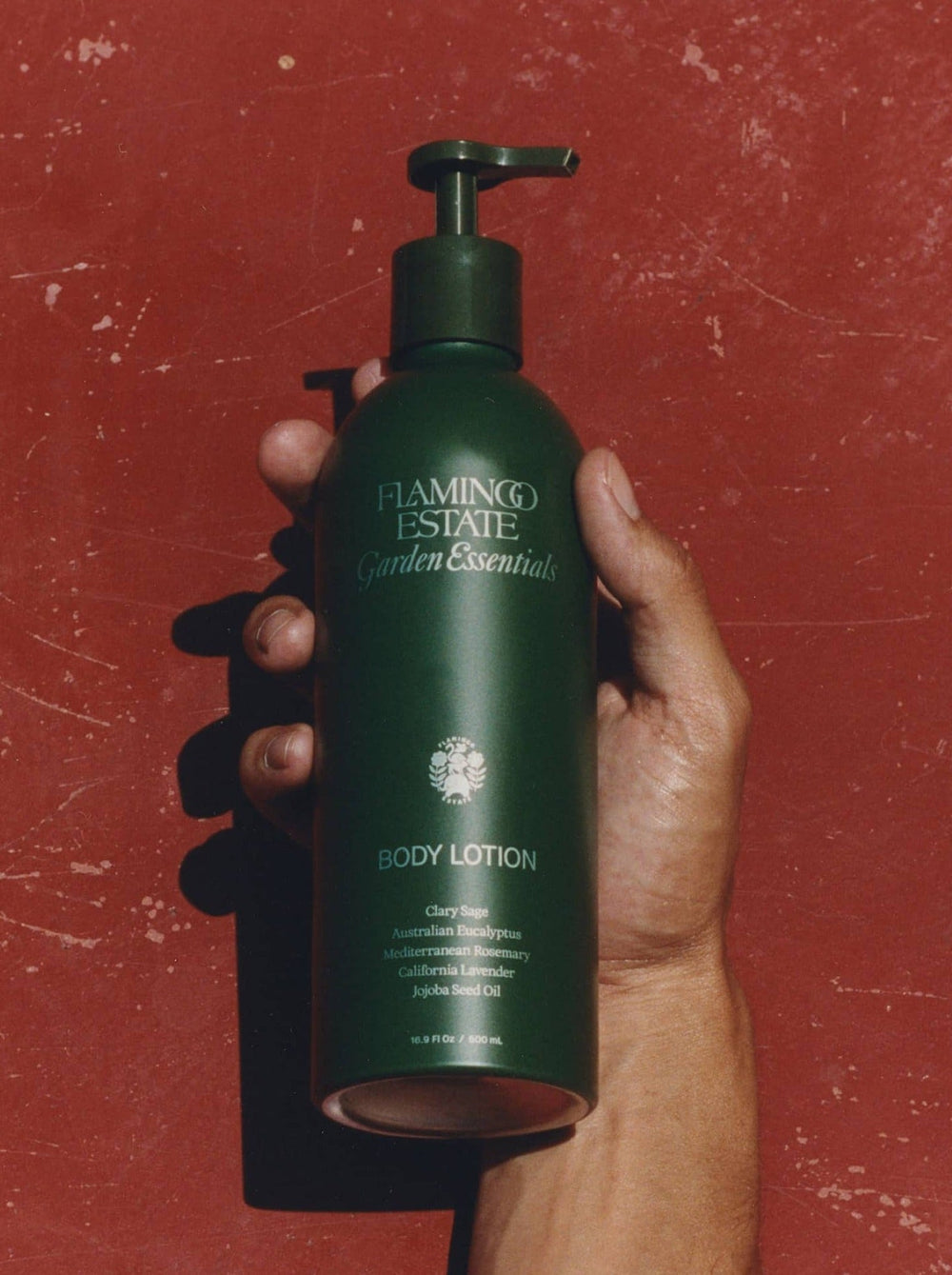 Hand Holding A Bottle Of Flamingo Estate 