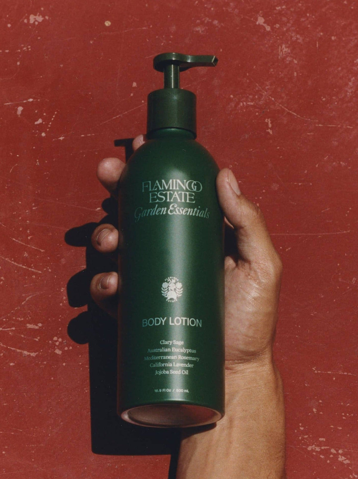 Hand Holding A Bottle Of Flamingo Estate 