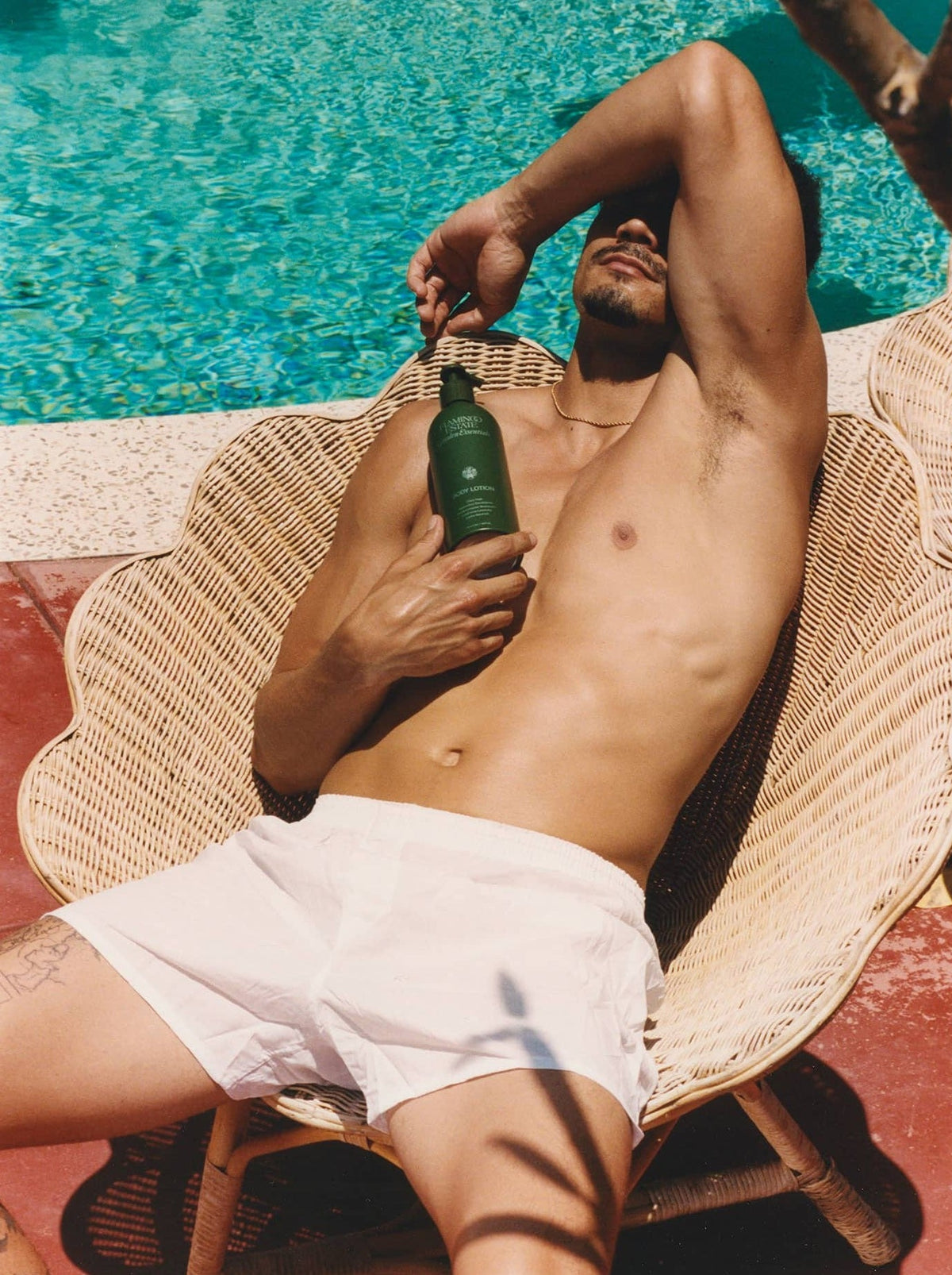 Man On A Seashell-Shaped Wicker Chair With A Flamingo Estate 