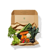 A cardboard box contains fresh vegetables.