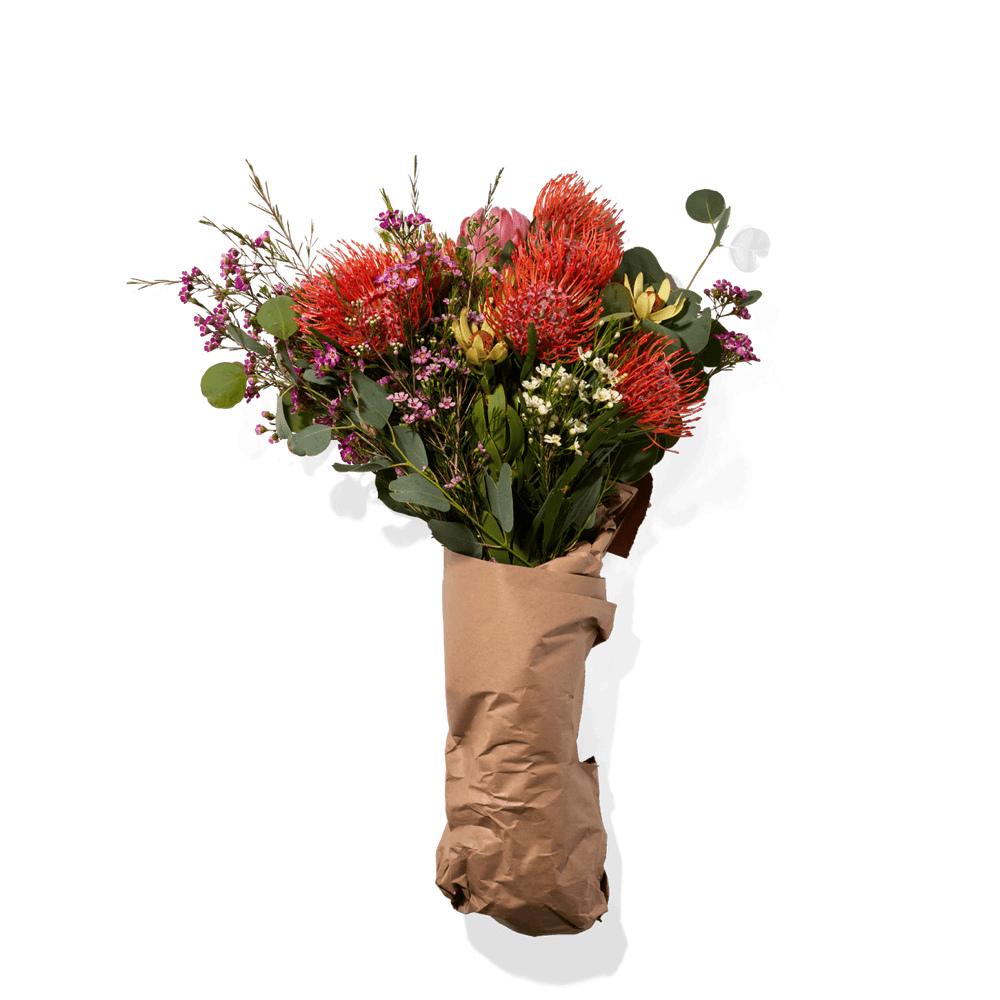 Vibrant Bouquet Of Assorted Flowers And Greenery, Arranged In Rustic-Style Paper Wrapping